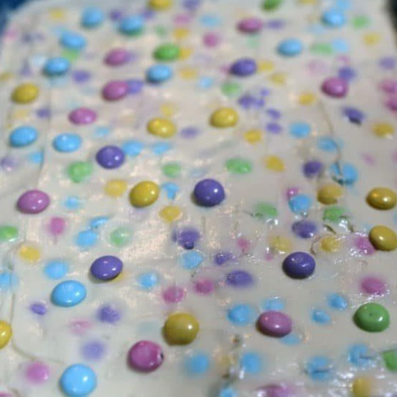 M&M Sopapilla Cheesecake Bars Recipe 14 cream cheese spread with m&m's