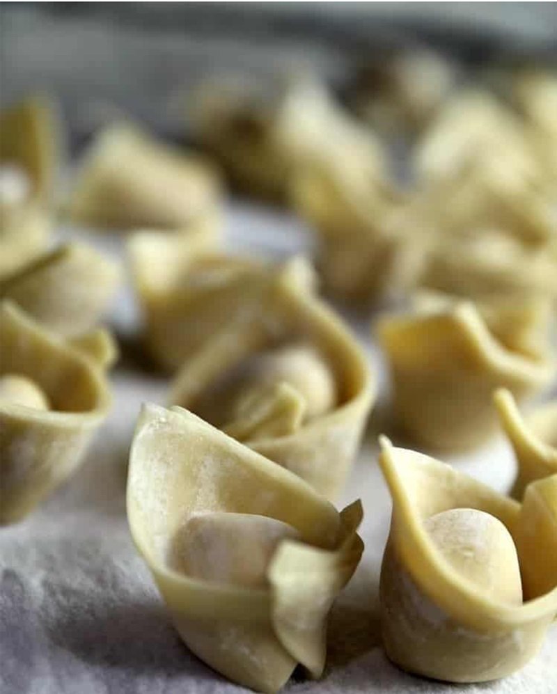 Strawberry Jalapeño Cream Cheese Wontons 16 folded wontons sitting on counter
