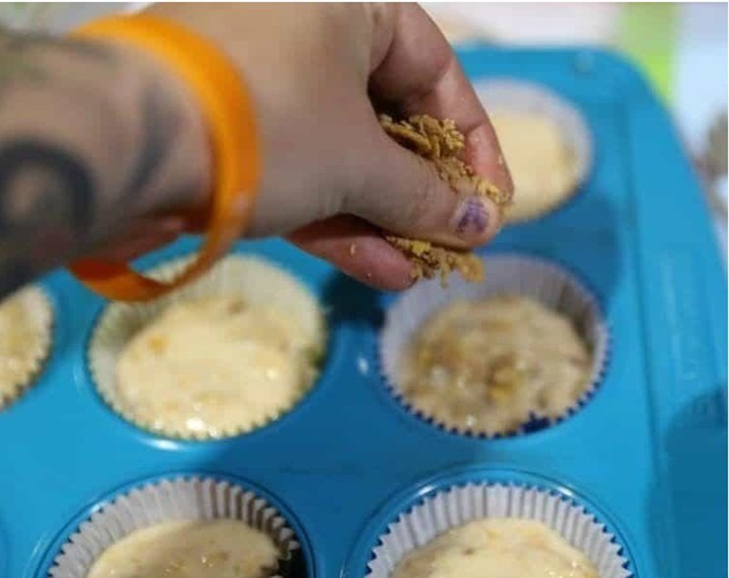 topping muffins with topping