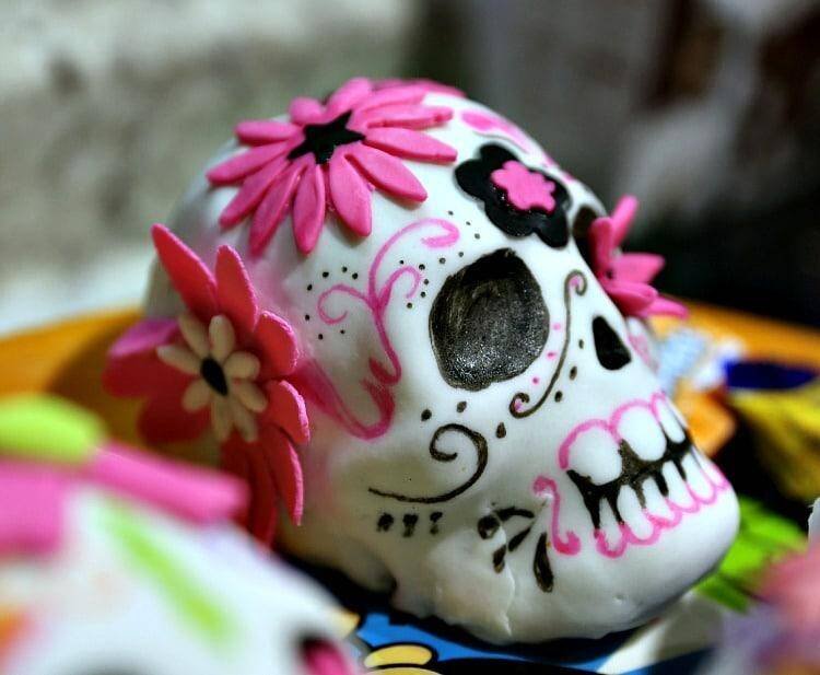 pink and black skull cake with flour
