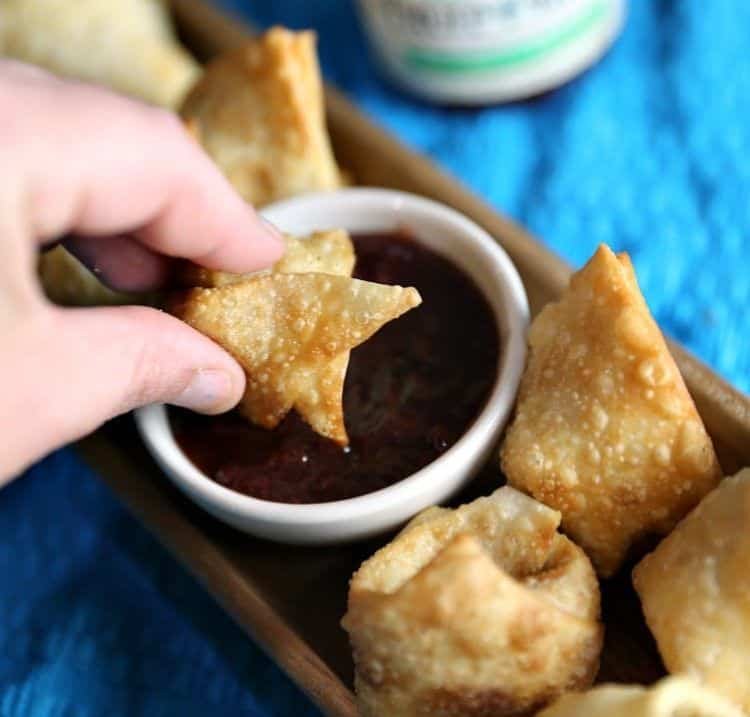 Strawberry Jalapeño Cream Cheese Wontons 19 dipping Strawberry Jalapeno Cream Cheese Wontons in jelly