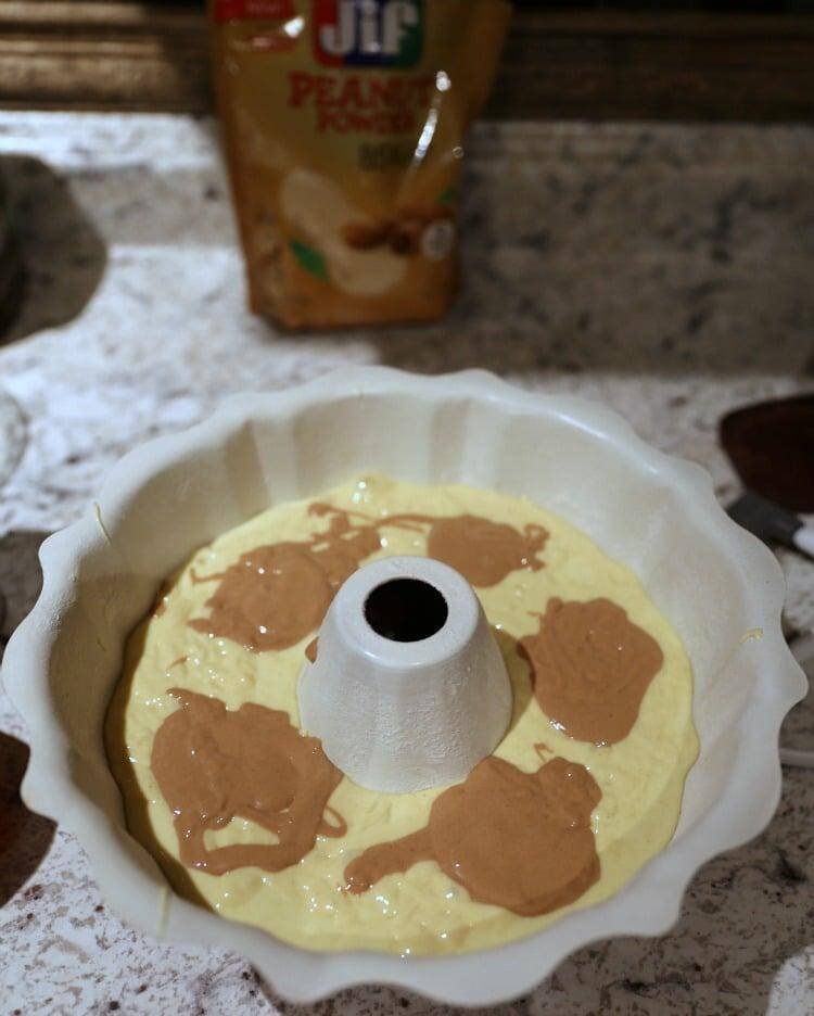 chocolate and honey cake batter in round pan