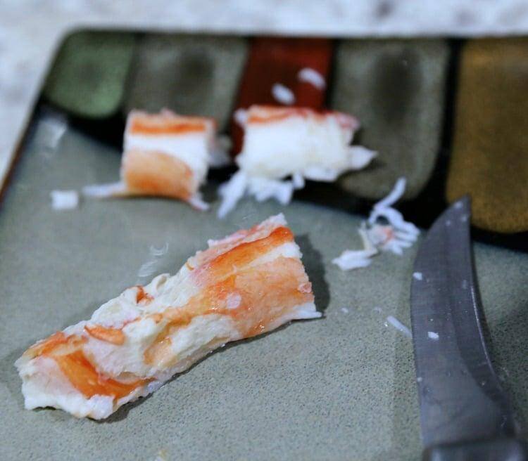 cubed crab with knife on plate
