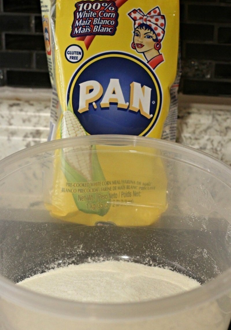 How To Make Tasty Fried Pickles 14 pan corn meal in a bowl