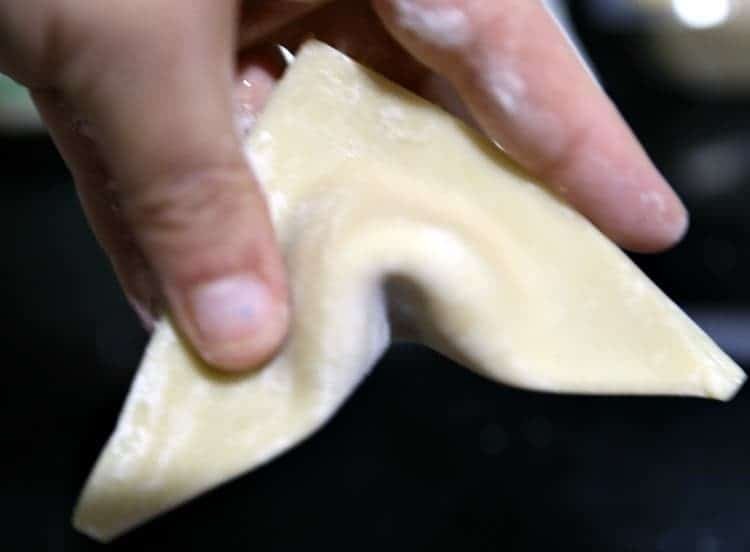Strawberry Jalapeño Cream Cheese Wontons 14 pinching wonton together to fold