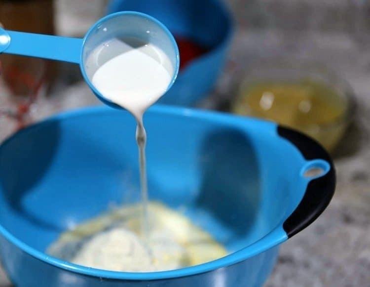 Delicious Banana Split Popsicles 12 pouring milk into bowl
