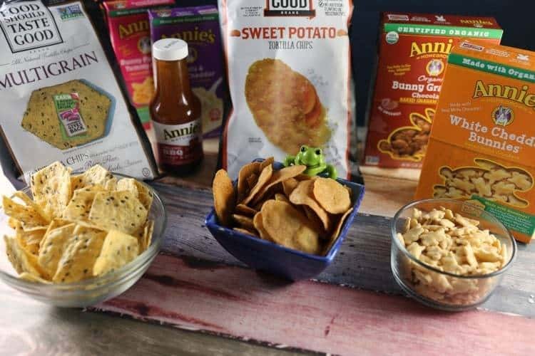 annies bunnies, chips and crackers on countertop in bowls with bags in the background.
