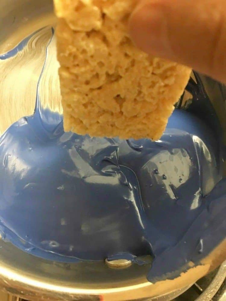 Easy Minions Rice Krispy Treats 11 rice Krispy treat going into blue candy melt