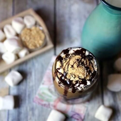 Epic S'more's Iced Coffee 14 S'more's Iced Coffee in mason jar sitting on courter with marshmallows