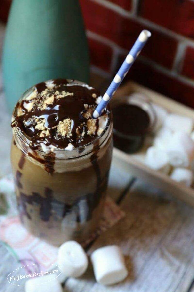Epic S'more's Iced Coffee 12 s'more's Coffee with blue straw chocolate syrup, whipping topping and graham crackers on top