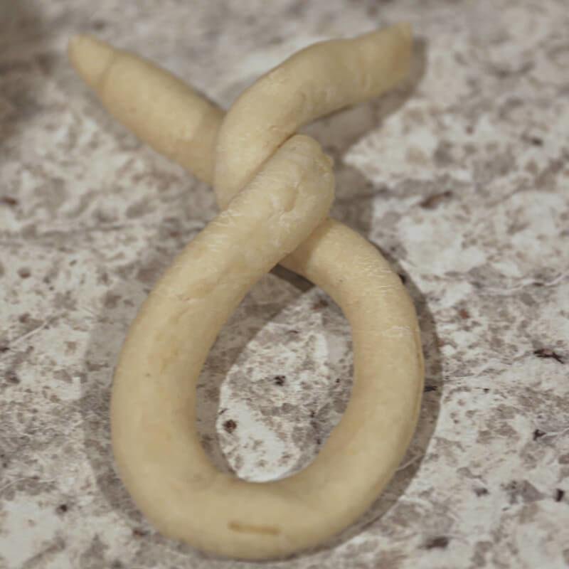 Delicious Homemade Soft Pretzels Stuffed with Brie Cheese 13 folding homemade soft pretzels
