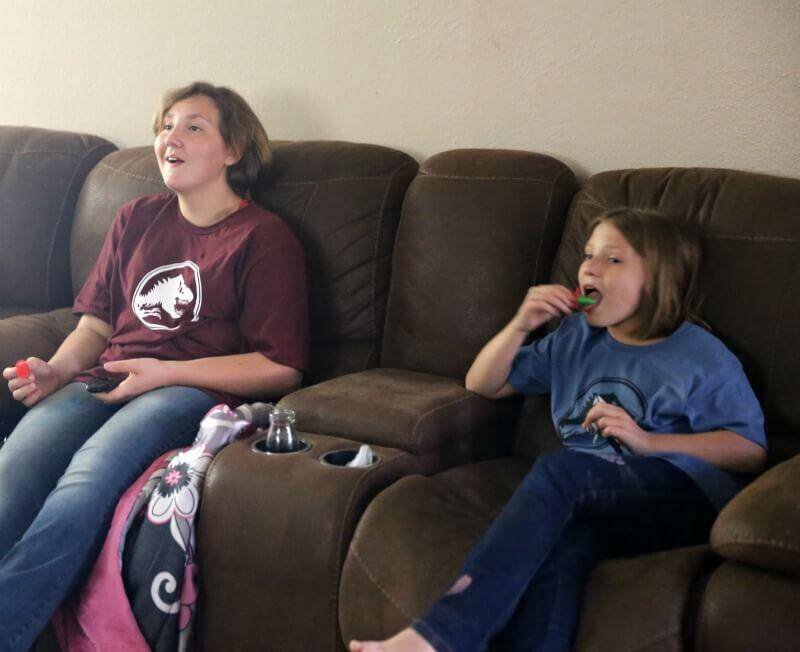 Hard-Boiled Dinosaur Eggs for Jurassic World Movie Night 14 jenn brockman girls sitting on couch wating movie