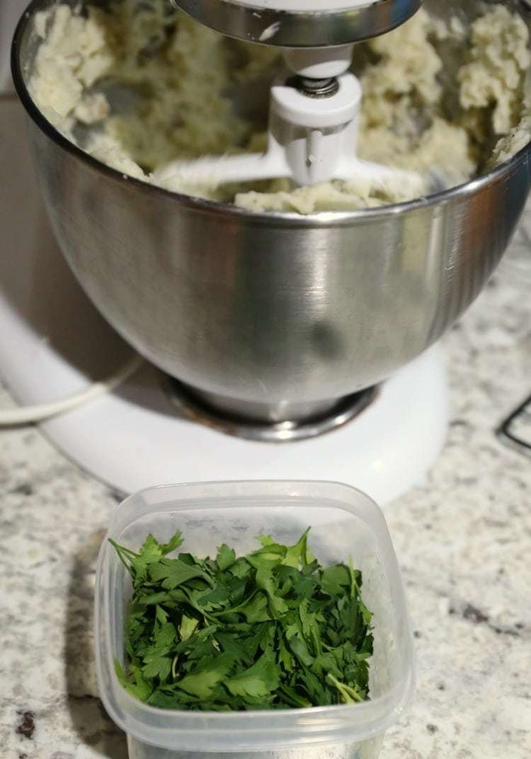 Twice Baked Potato Salad Recipe 15 parsley leaves in container with mixer in background