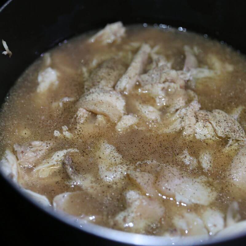 Delish Chicken and Dumplings Recipe 14 shredded chicken cooking