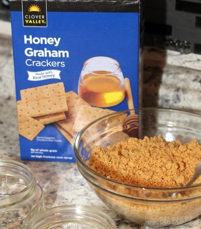 Easy & Delish Mason Jar Key Lime Pies 12 smashed graham crackers in a glass bowl