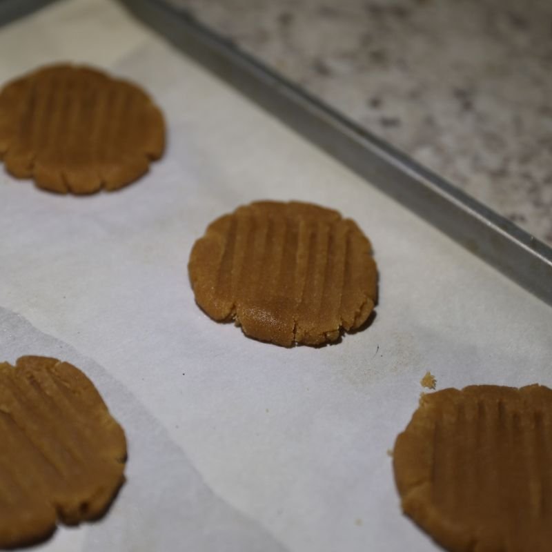 Three Ingredient Peanut Butter Cookies 13 peanut butter cookies on baking sheet