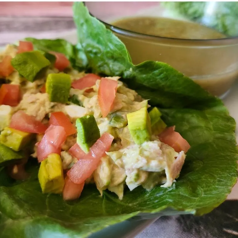 The Ultimate Avocado Tuna Salad Wrap (High-Protein & Low Calorie Lunch) 16 close up on avocado tuna salad wrap topped with diced tomato's and avocado