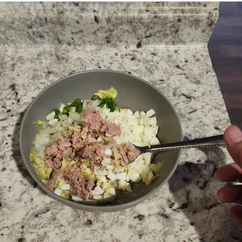 The Ultimate Avocado Tuna Salad Wrap (High-Protein & Low Calorie Lunch) 14 diced onions, jalapenos, eggs and tuna in grey bowl with fork