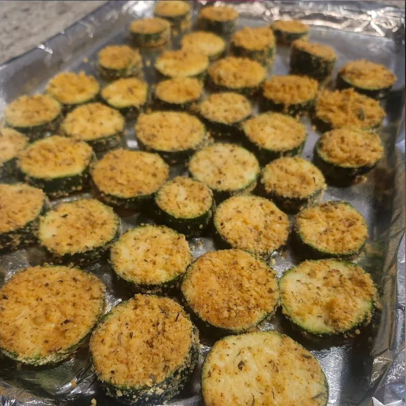 parmesan zucchini on pan before going in oven