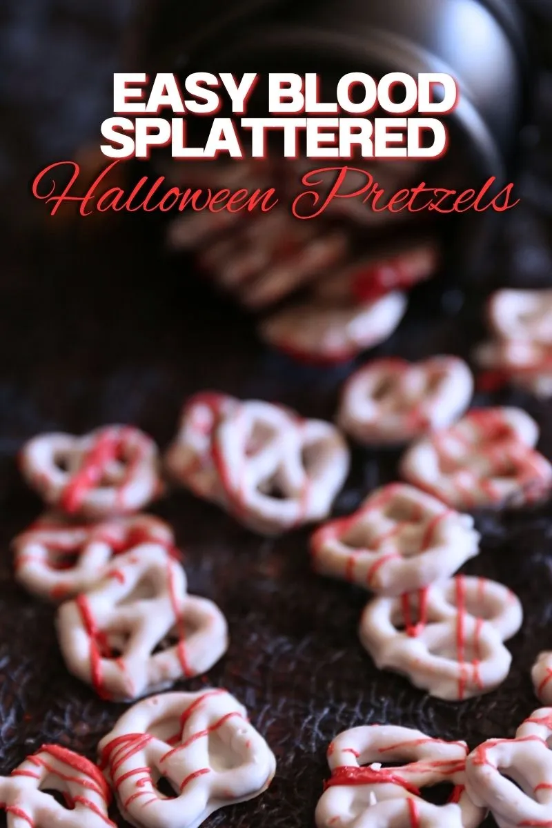 Halloween blood splattered pretzels coated in white candy coating and drizzled with red candy melts.