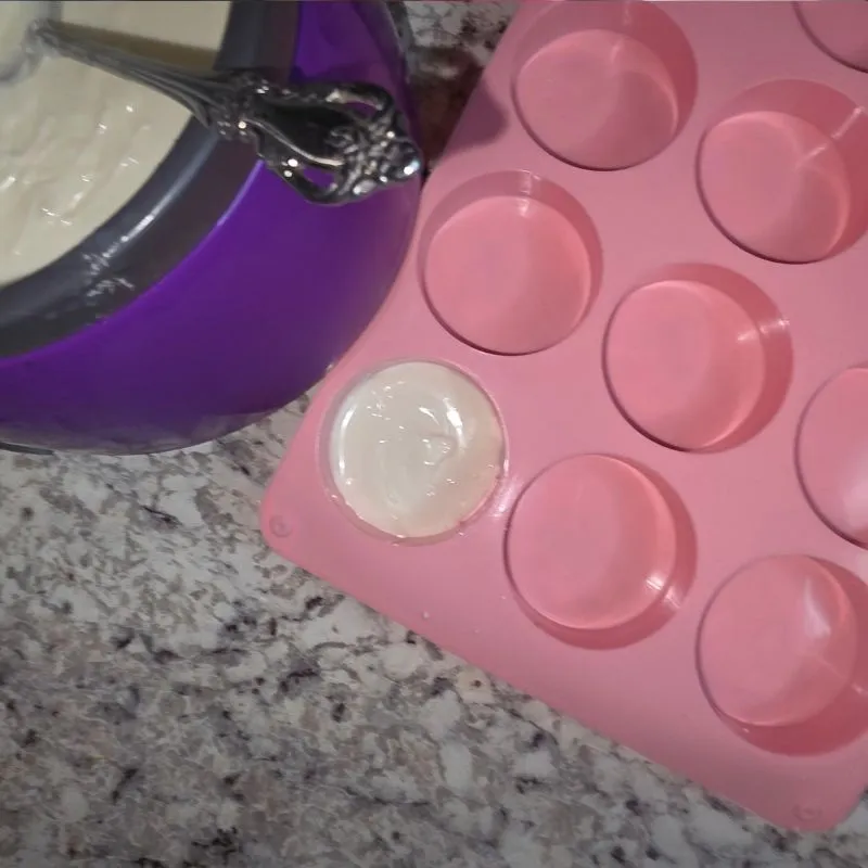 bottom of pink mold coated in almond bark