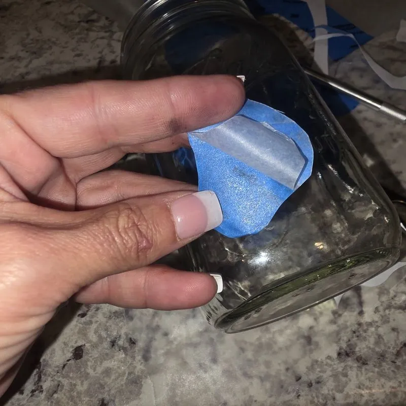 Awesome DIY Dog Treat Jar Using a Mason Jar 15 peeling parchment paper of the back of homemade sticker using tape