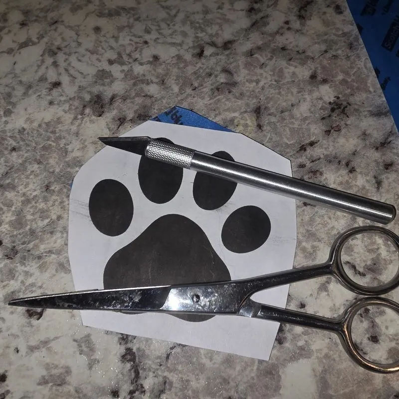 Awesome DIY Dog Treat Jar Using a Mason Jar 14 homemade paw sticker scissors and X-ACTO knife on counter